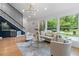 Living room with bar, staircase, and ample natural light at 2001 Swazey Dr, Decatur, GA 30032