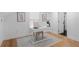 Cozy home office space featuring light wood flooring, a minimalist desk, and white walls at 2001 Swazey Dr, Decatur, GA 30032