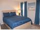Beautifully appointed bedroom with soft blue bedding and ample natural light at 4190 Wingfoot Ct, Decatur, GA 30035