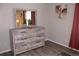 Bedroom with a light dresser, framed mirror, neutral-toned walls, and a cozy ambiance at 4190 Wingfoot Ct, Decatur, GA 30035