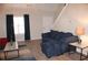 Comfortable living room featuring a plush blue sofa and an inviting atmosphere at 4190 Wingfoot Ct, Decatur, GA 30035