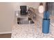 Close-up of a modern kitchen sink with granite countertop and stylish fixtures at 4190 Wingfoot Ct, Decatur, GA 30035