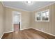 Dining area features hardwood floors, window, and views into the next room at 4222 Webb Rd, Tucker, GA 30084