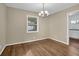 Dining room showcasing hardwood floors and a modern chandelier at 4222 Webb Rd, Tucker, GA 30084