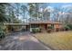 Charming brick home featuring a carport and an inviting front porch at 4222 Webb Rd, Tucker, GA 30084