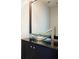Contemporary powder room with a unique glass vessel sink and modern fixtures at 1265 Birchwood Ln, Roswell, GA 30076