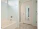 Bright bathroom with a tub and shower at 1265 Birchwood Ln, Roswell, GA 30076