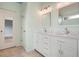 Stylish bathroom with double vanity, marble countertops, and plenty of storage space at 1265 Birchwood Ln, Roswell, GA 30076