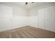 A cozy bedroom with light walls, neutral carpet, and a closet for efficient storage at 1265 Birchwood Ln, Roswell, GA 30076