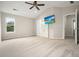 Spacious bedroom featuring a vaulted ceiling, ceiling fan, and access to a bathroom at 1265 Birchwood Ln, Roswell, GA 30076