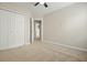 Bedroom with carpet, fan, and a view to other rooms at 1265 Birchwood Ln, Roswell, GA 30076