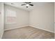 A bedroom with plush carpet, fan, and a window with blinds at 1265 Birchwood Ln, Roswell, GA 30076