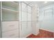 A large, organized walk-in closet with shelves and drawers at 1265 Birchwood Ln, Roswell, GA 30076
