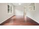 Dining room with hardwood floors and a large window providing ample natural light at 1265 Birchwood Ln, Roswell, GA 30076