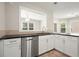 Updated kitchen featuring stainless steel appliances, granite countertops, and tile backsplash at 1265 Birchwood Ln, Roswell, GA 30076