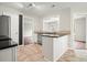 Efficient kitchen with stainless steel appliances, granite countertops, and an eat-in bar at 1265 Birchwood Ln, Roswell, GA 30076