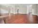 Spacious living room featuring hardwood floors and ample natural light showcasing an open floor plan at 1265 Birchwood Ln, Roswell, GA 30076