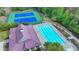 Aerial view of the pool and tennis courts at the community clubhouse at 2325 Lake Cove Ct, Buford, GA 30519