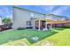 Large backyard features a spacious lawn, patio, mature trees, and wood fence for privacy and outdoor enjoyment at 2325 Lake Cove Ct, Buford, GA 30519