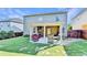 Spacious backyard boasts a covered patio, mature landscaping, and privacy fencing for outdoor enjoyment at 2325 Lake Cove Ct, Buford, GA 30519