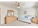 Comfortable bedroom featuring daybed with storage, carpet and ceiling fan at 2325 Lake Cove Ct, Buford, GA 30519