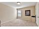 Bright bedroom featuring neutral walls and carpet, a window and a simple decor at 2325 Lake Cove Ct, Buford, GA 30519