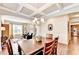 Formal dining area featuring hardwood floors and stylish chandelier at 2325 Lake Cove Ct, Buford, GA 30519