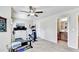 Home gym with treadmill, elliptical, free weights, and view to an attached bathroom at 2325 Lake Cove Ct, Buford, GA 30519