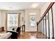 Bright foyer with hardwood floors, staircase, and ample natural light, creating a warm and inviting entrance at 2325 Lake Cove Ct, Buford, GA 30519