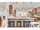 Well-equipped kitchen with island, breakfast bar, and stainless steel appliances at 2325 Lake Cove Ct, Buford, GA 30519