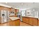 This eat-in kitchen features granite countertops, stainless steel appliances, and a large center island at 2325 Lake Cove Ct, Buford, GA 30519
