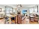 Bright living room featuring fireplace and adjacent kitchen and dining area at 2325 Lake Cove Ct, Buford, GA 30519