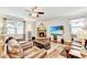 Cozy living room with stone fireplace and comfortable leather seating at 2325 Lake Cove Ct, Buford, GA 30519