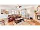 Spacious living room with stone fireplace and hardwood flooring at 2325 Lake Cove Ct, Buford, GA 30519