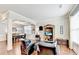 Inviting living room featuring hardwood floors, wainscoting, and abundant natural light in a stylish home at 2325 Lake Cove Ct, Buford, GA 30519