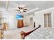 Large main bedroom with flat screen tv, fan and ensuite bathroom at 2325 Lake Cove Ct, Buford, GA 30519