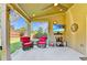 Covered patio featuring comfortable seating, an outdoor television, and décor perfect for entertaining at 2325 Lake Cove Ct, Buford, GA 30519