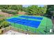 Aerial view of two community tennis courts, perfect for sports enthusiasts at 2325 Lake Cove Ct, Buford, GA 30519