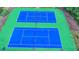 Overhead view of community tennis courts with a green and blue surface at 2325 Lake Cove Ct, Buford, GA 30519
