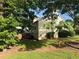 Backyard showcasing trees providing natural shade and space for entertaining at 2765 Dahlonega Trl, Austell, GA 30106