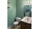 Cozy bathroom with a toilet and vanity, featuring a convenient laundry area reflected in the mirror at 2765 Dahlonega Trl, Austell, GA 30106