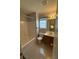 Bright bathroom featuring a tub and shower combo, complemented by a vanity sink with window at 2765 Dahlonega Trl, Austell, GA 30106
