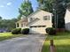 Attractive house with an attached garage, complemented by lush green lawn at 2765 Dahlonega Trl, Austell, GA 30106