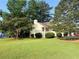 Well-maintained lawn with mature trees and landscaping, creating curb appeal at 2765 Dahlonega Trl, Austell, GA 30106