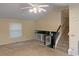 Open-concept room featuring a ceiling fan and a staircase at 2765 Dahlonega Trl, Austell, GA 30106