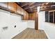 Basement featuring wood cabinets and vinyl flooring at 5619 Beaver Sw Dr, Mableton, GA 30126