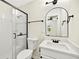 Updated bathroom featuring a glass shower, white vanity, sink, and mirror at 5619 Beaver Sw Dr, Mableton, GA 30126