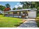 Charming single-story home featuring a welcoming front porch and well-maintained lawn at 5619 Beaver Sw Dr, Mableton, GA 30126