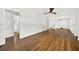 Spacious living room featuring hardwood floors and neutral walls leading to dining and bath at 5619 Beaver Sw Dr, Mableton, GA 30126