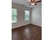 Bedroom featuring a ceiling fan and a window with views of the outdoors at 5890 Crowley Dr, Douglasville, GA 30135